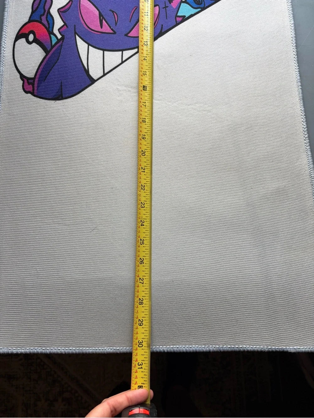 White Bath Mat with Purple Character Graphic